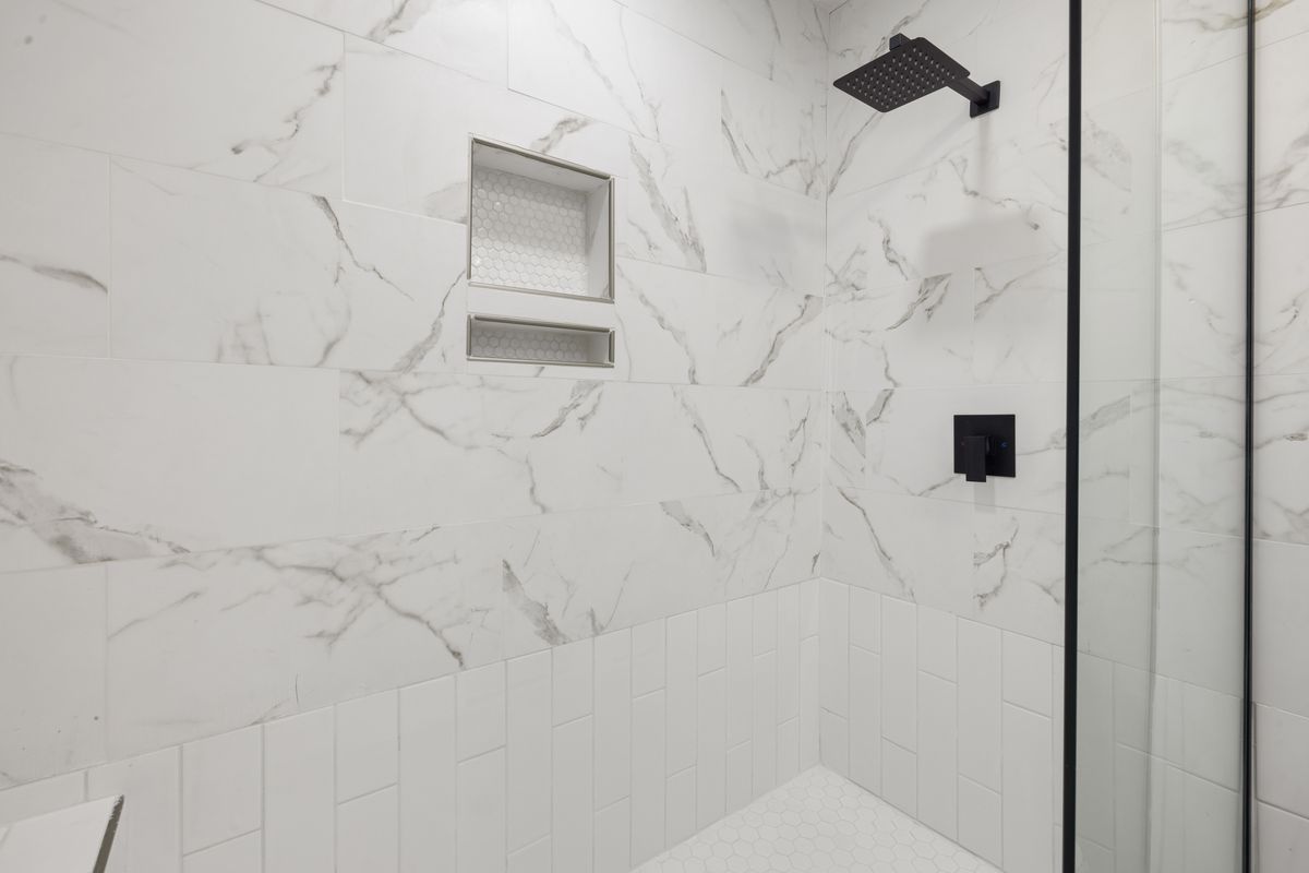 Large-Format Marble Tile Shower Close-Up