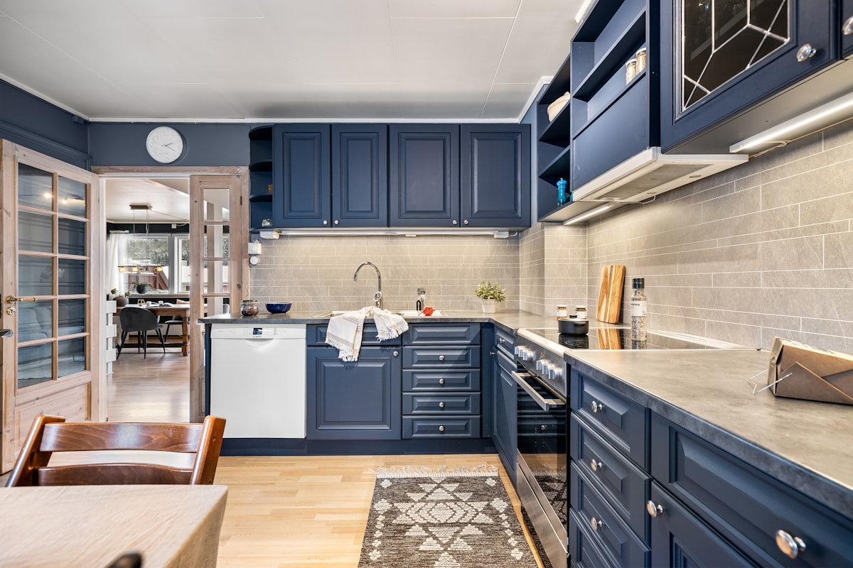 Navy Blue Cabinet Kitchen with Subway Tile